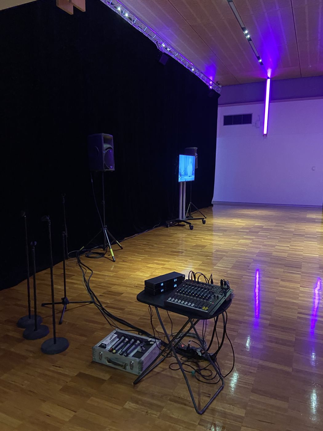Portable PA, mixer and wireless mics set up in a function room