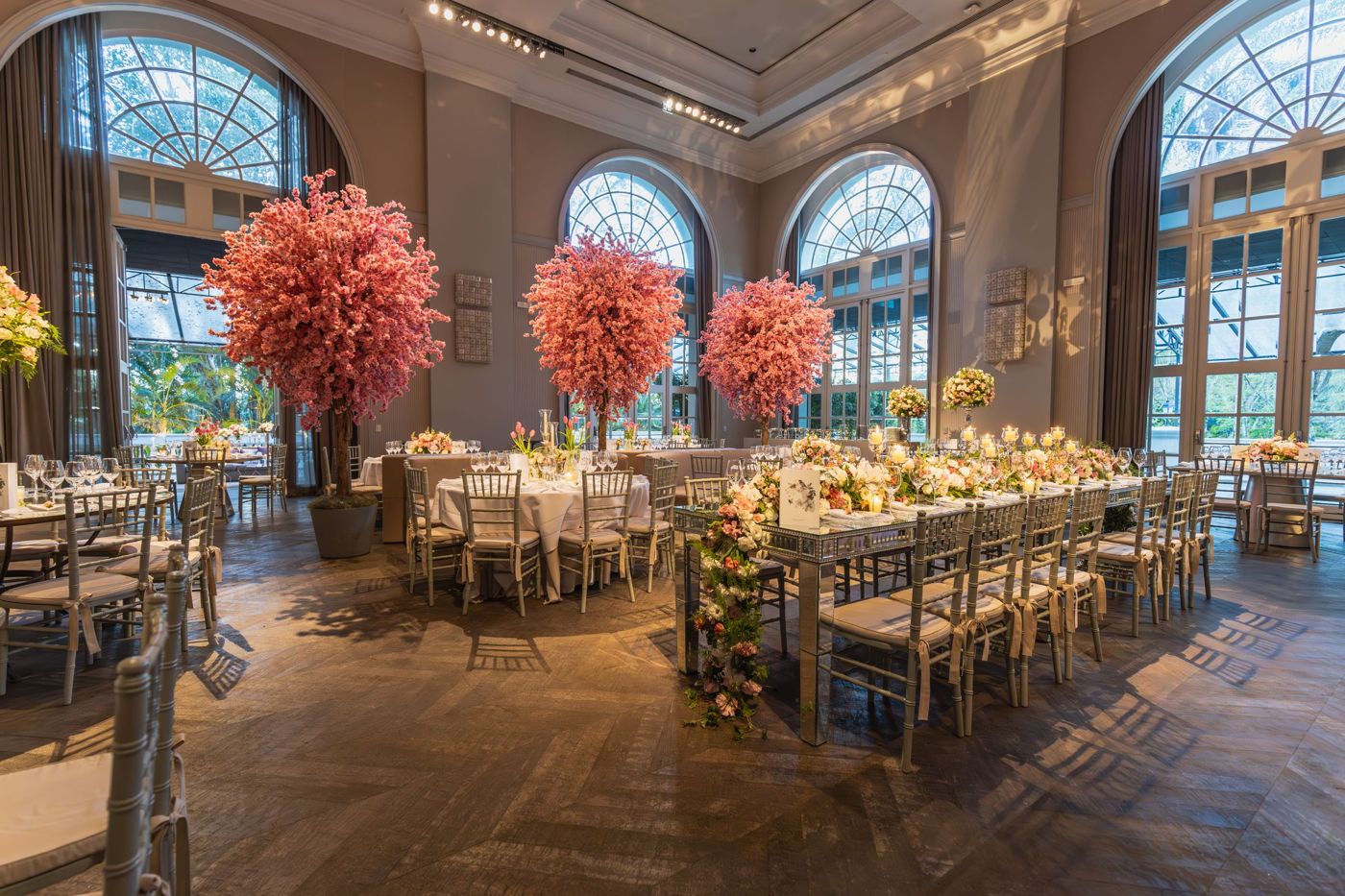 Wedding reception room with blossom centrepieces